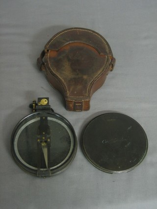 A circular bronzed pocket sextant marked Cary London 4" complete with leather case