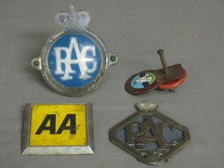 An old metal RAC radiator badge, an enamelled Caravan Club of Great Britain and Ireland badge, an RAC badge and an AA badge