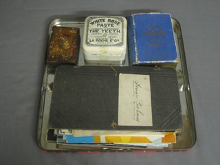 An album of various postcards, a Waddingtons Lexicon card game, a White & Ross toothpaste jar and a small reproduction Icon