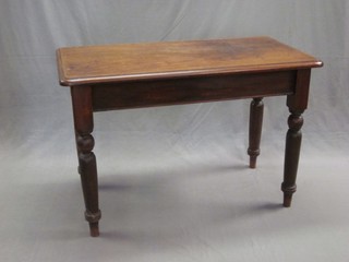 A Victorian mahogany side table raised on turned supports 43"