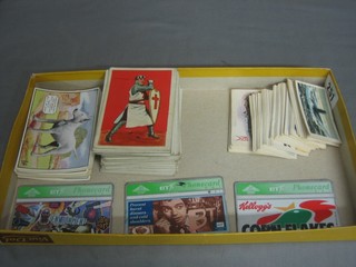 A set of cigarette cards - Champion Dogs, do. Soldiers of The World, various tea cards and 3 phone cards