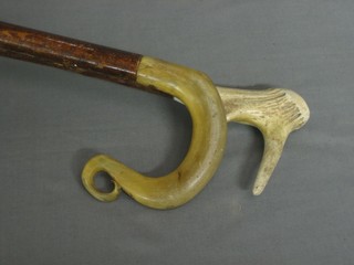 A crook with stag horn handle and a stag horn walking stick