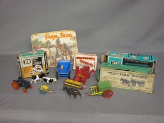 A Britons farm wagon Number 5F boxed, various other Britons farm yard scenery boxed, together with a collection of animals, figures, farm equipment etc