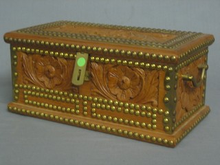 A carved hardwood trinket box with hinged lid 11"