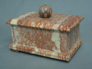 An Art Deco rectangular pink veined marble trinket box with ball finial, raised on block feet (1 missing) 9 1/2"