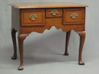 An 18th/19th Century oak low boy, fitted 1 long drawer flanked by 2 short drawers, raised on cabriole supports 32"