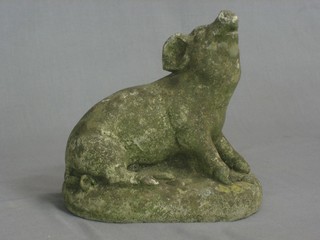 A concrete figure of a seated pig 7"