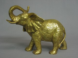 A brass figure of a walking elephant 8"