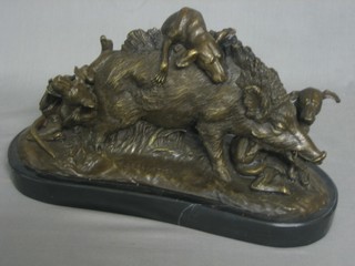 A reproduction bronze sculpture in the form of dogs and wild boar, raised on a marble base 15"