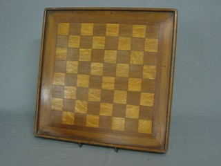 A wooden chess board 16"