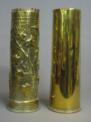 A 18lb Trench Art shell case and 1 other 18lb shell case