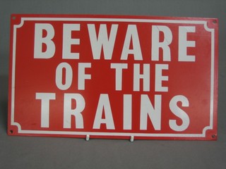 A reproduction enamelled and metal sign - Beware of Trains 9" x 10"