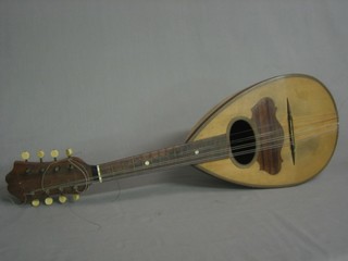 A mandolin, the interior labelled Francesco Perretti & Figli Fabbrica di Strumenti Musical
