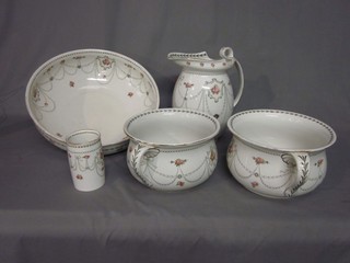 A Royal Doulton 5 piece wash set comprising circular bowl (cracked), jug (slight chip to base), 2 chamber pots and a tooth brush mug