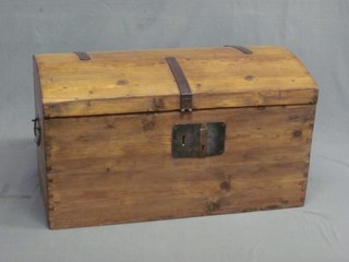 A Continental stripped and polished pine dome shaped trunk with iron handles, 37"