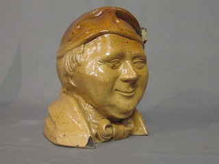 A 19th Century salt glazed flagon in the form of a head and shoulders portrait bust of a gentleman 10" (chip to rim)
