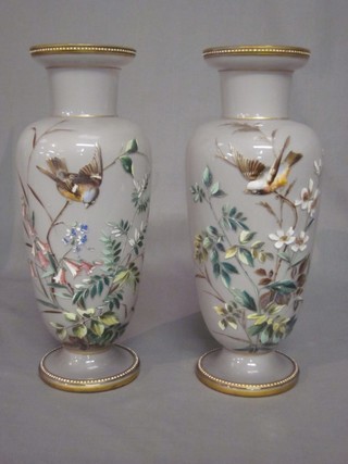 A pair of Victorian opaque glass club shaped vases painted birds amidst flowers, the bases marked 3, 11"