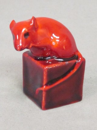 A Royal Doulton flambe figure of a seated mouse sat on a cube of cheese 2"