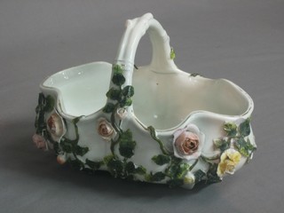 A Continental porcelain oval shaped floral encrusted basket 7"