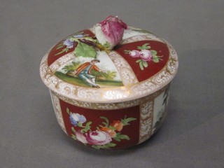A Dresden style circular cylindrical porcelain jar and cover with panelled decoration depicting figures, the base with Crowned D, 3" (chipped)