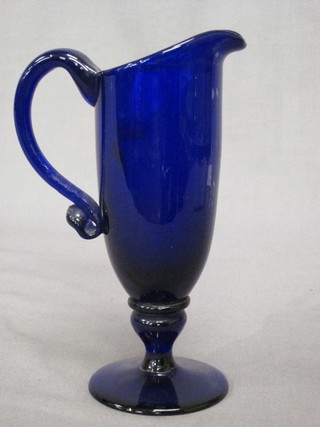 A Bristol blue glass jug raised on a circular spreading foot 6 1/2"