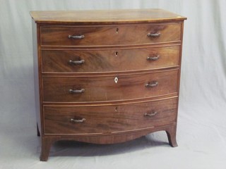 A Georgian mahogany bow front chest with crossbanded top and satinwood stringing fitted 4 long drawers with replacement handles 40"