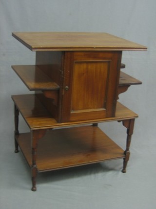 A Victorian rectangular walnut 3 tier smoker's cabinet/table, the centre section incorporating a cabinet with pipe racks to the side above a recess, raised on turned supports 24" 