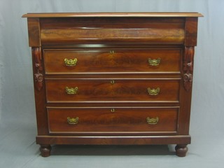 A Victorian mahogany Cumberland style chest fitted a secret drawer above 3 long drawers with brass drop handles, having  scrolled decoration to the side, raised on bun feet 44"