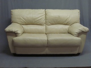 A 2 seat sofa upholstered in white hide 58"