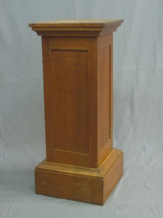 A square honey oak pedestal 15"
