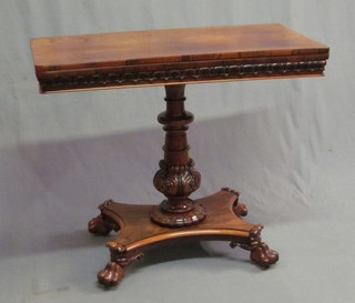 A William IV rosewood card table, raised on a turned column with triform base and paw feet 36"