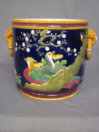 A 19th Century Minton Majolica cylindrical twin handled jardiniere decorated birds, the base marked 1679 and with circular Minton impressed mark 11" (heavily chipped to base and with crack)