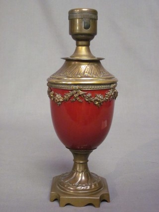 A red glazed porcelain and gilt metal mounted table lamp 10"