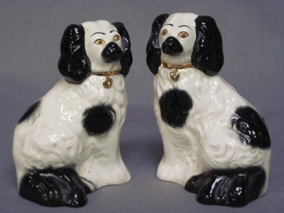 A pair of Beswick figures of seated Spaniels, the base marked Beswick England 5"