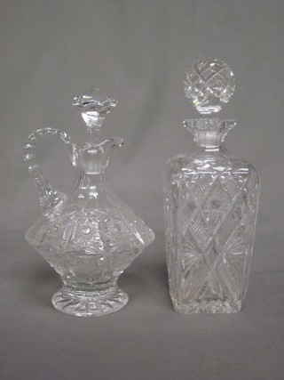 A cut glass spirit decanter and stopper and a ewer