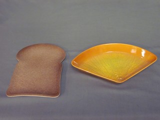 A Carltonware dish in the form of a slice of brown bread and 1 other shaped dish in the form of a slice of orange