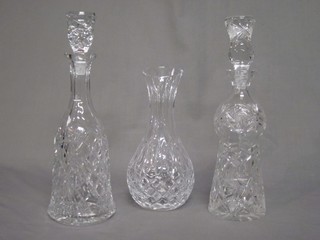 2 cut glass decanters and stoppers 13" and a Stewart cut glass club shaped vase 10"