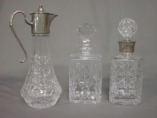 2 cut glass spirit decanters and stoppers and a claret jug