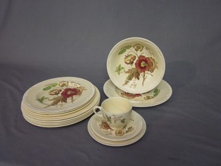 A 6 piece Clarice Cliff Georgian Spray dinner service comprising 10" plate, 9" side plate, 8" bowl, 6 1/2" tea plate, cup and saucer and 5 Clarice Cliff white glazed plates 10" and 2 side plates 9"
