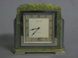 An Art Deco mantel clock with square silvered dial and Arabic numerals contained in an onyx and chromium plated mounted case 8", by Mappin & Webb