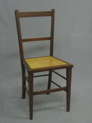An Edwardian inlaid mahogany ladderback bedroom chair with woven cane seat