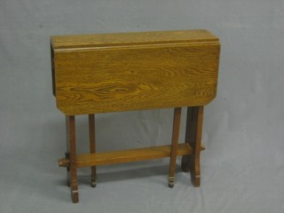 An Art Nouveau oak Sutherland table raised on pierced supports 24"