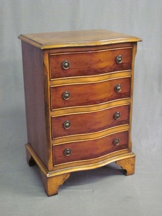 A Georgian style yew chest of serpentine outline, fitted 4 long drawers, raised on bracket feet 19"