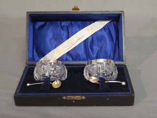 A pair of Edwardian circular cut glass salts with silver rims Birmingham 1905, cased