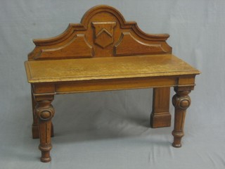 A Victorian oak hall bench with raised back and on turned supports 33"
