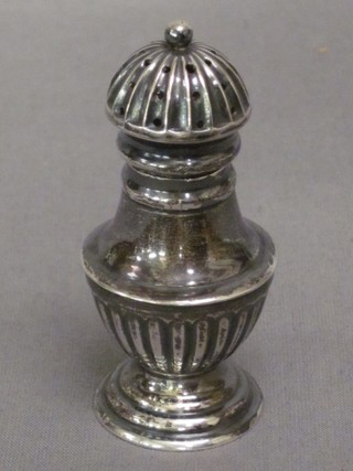 A Victorian circular embossed silver pepperette, Birmingham 1893