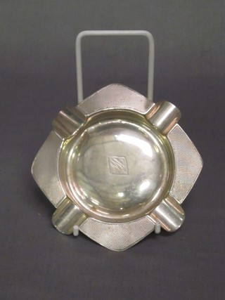 An Art Deco white metal ashtray