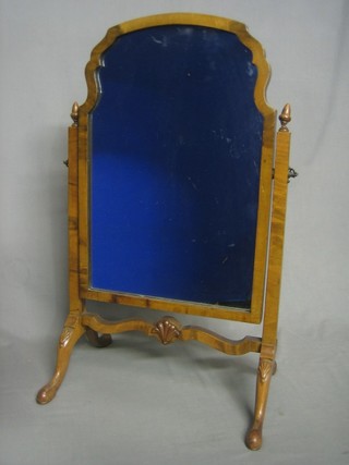 A Queen Anne style arched plate dressing table mirror contained in a walnut swing frame 15"