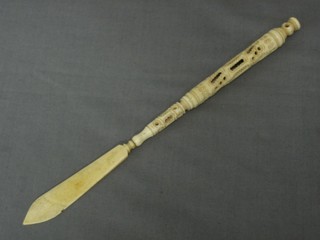 A Victorian pierced ivory paper knife/pen dip, the handle set a Stanhope of Hastings