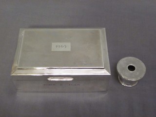 A silver cigarette box with hinged lid Birmingham 1960 5" and a silver dressing table jar lid